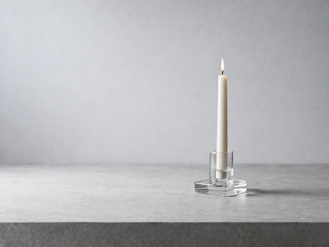 Neutral candle styling that supports calm and visual balance