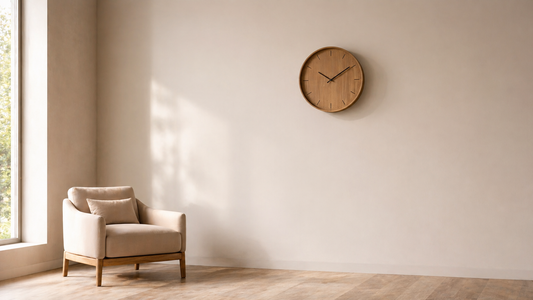Minimal wall with a single round clock placed off-center, creating visual rhythm through balanced spacing and soft diffused light.