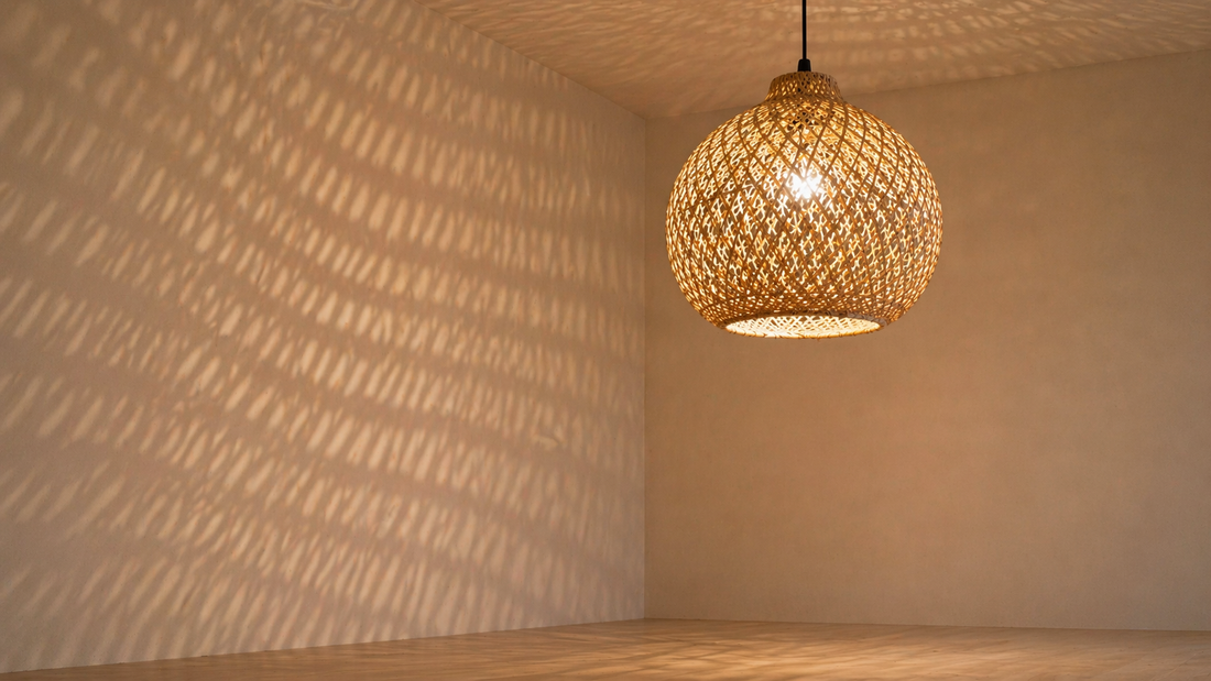 Ceiling light with woven texture casting soft patterned shadows across a wall.